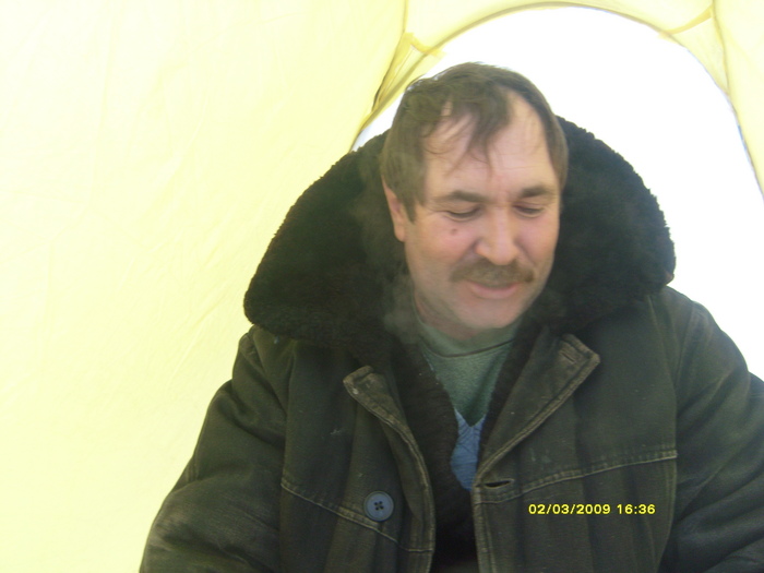 В палатке.